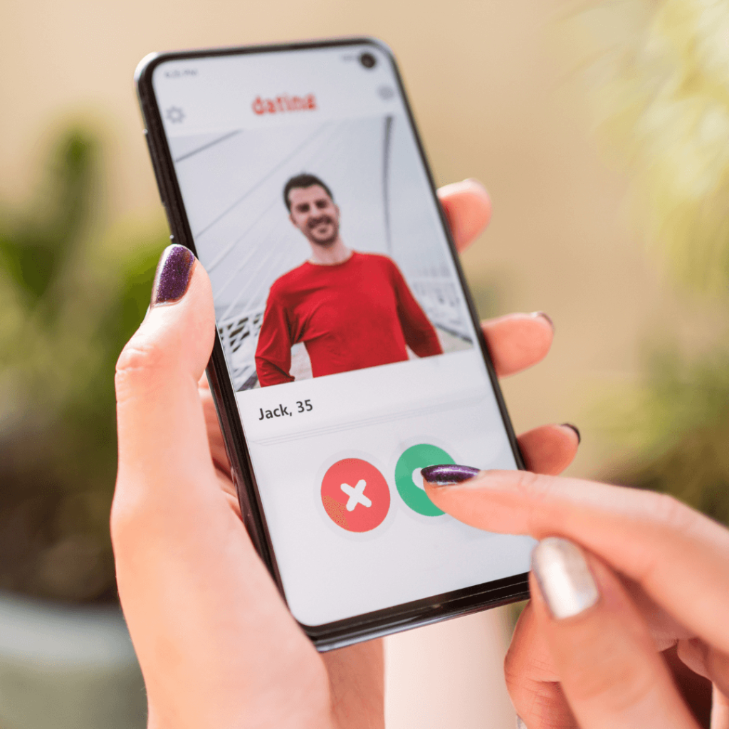 A close-up of a woman's hands holding a smartphone displaying a dating app profile of a man named Jack, age 35, wearing a red shirt. The image highlights the online dating process, relevant to Orlando Date Coach services for optimizing online dating profiles.